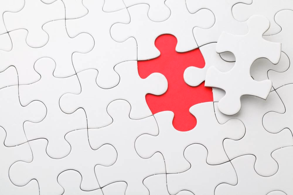 White puzzle with a red centre piece
